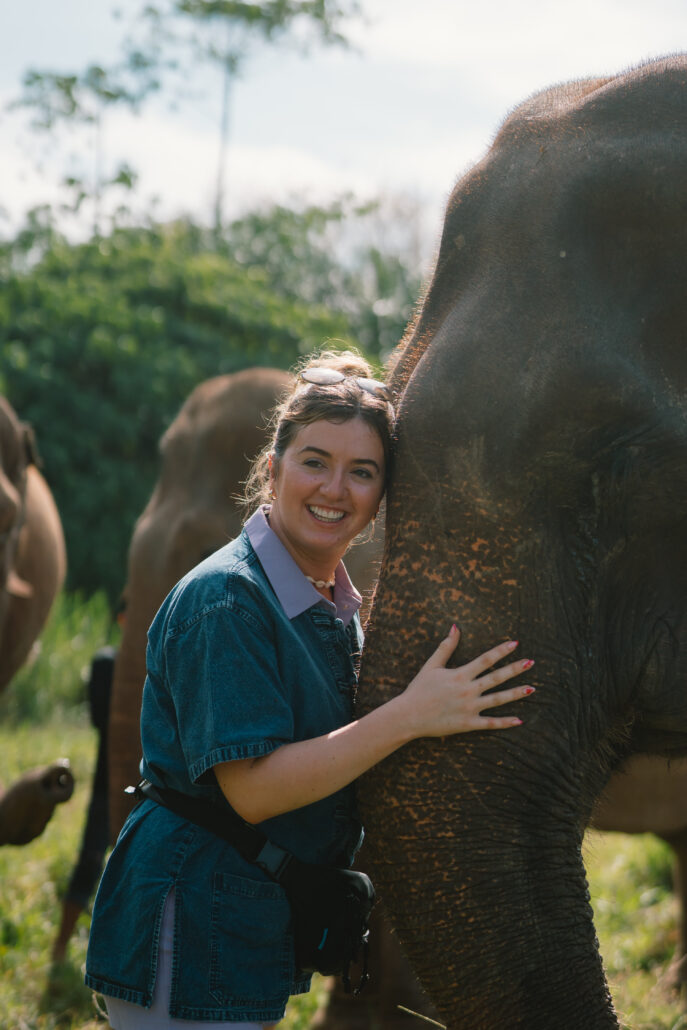 Guest hugging a rescued elephant at Krabi Elephant House Sanctuary